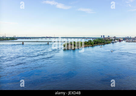 Montreal, Canada - May 27, 2017: Aerial view of old port area with Champlain and Victoria bridges in city in Quebec region during sunset Stock Photo