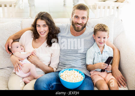 Family having fun while watching television Stock Photo