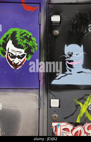 Barcelona, Spain - March 14, 2011: Graffiti of Joker and Batman painted on student desks in Massana art school in Barcelona, Spain. Stock Photo