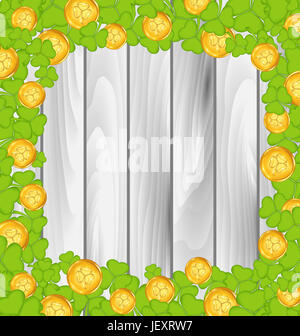Illustration border with shamrocks and golden coins for St. Patrick's Day, grey wooden background - Stock Photo