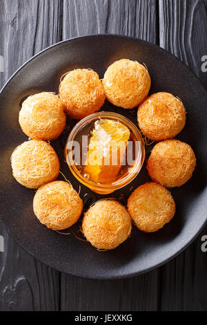 Traditional Arabic pastry cake named kadaif or kataifi. vertical view from above Stock Photo