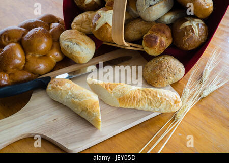 Collection of breads including Challah, baguettes and rolls Stock Photo