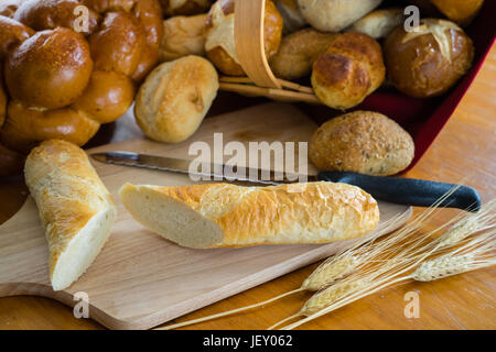 Collection of breads including Challah, baguettes and rolls Stock Photo