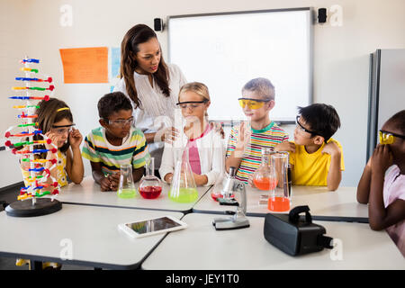 A teacher giving a science lesson Stock Photo