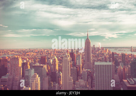 View of New York City skyline seen from midtown Manhattan looking downtown. This image has vintage tone filter. Stock Photo