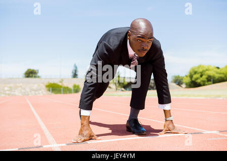 Businessman ready to run Stock Photo