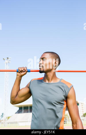 Athlete holding javelin on his shoulder Stock Photo