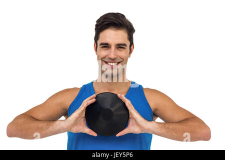 Male athlete posing with discus throw Stock Photo