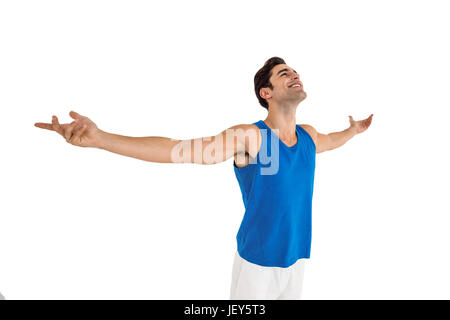 Excited male athlete with arms outstretched Stock Photo