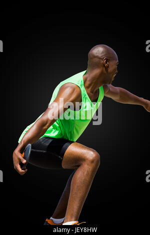 Rear view of sportsman throwing a discus Stock Photo - Alamy