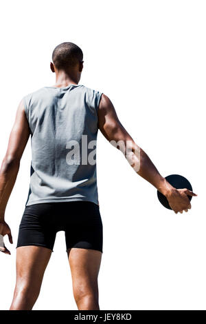 Rear view of sportsman holding a discus Stock Photo - Alamy