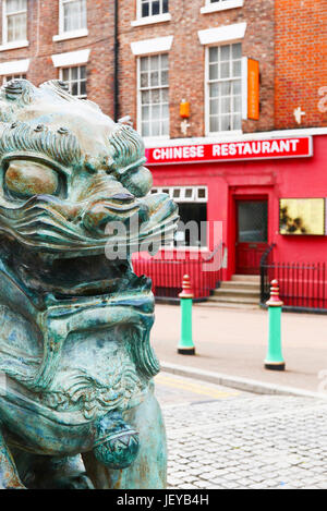 Chinese dragon statue in front of chinese restaurant,Chinatown,Liverpool,UK Stock Photo