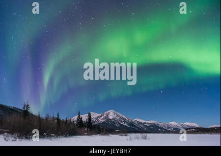 The beautiful Northern Lights photographed at night on the frozen Koyukuk river in Wiseman, Alaska. Stock Photo