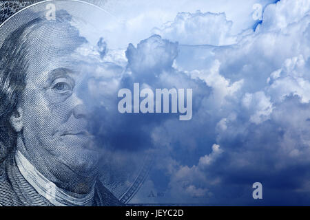 conceptual image of one hundred US dollar bill in cloudy sky Stock Photo