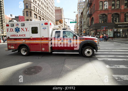 fdny ambulance speeding through New York City USA Stock Photo