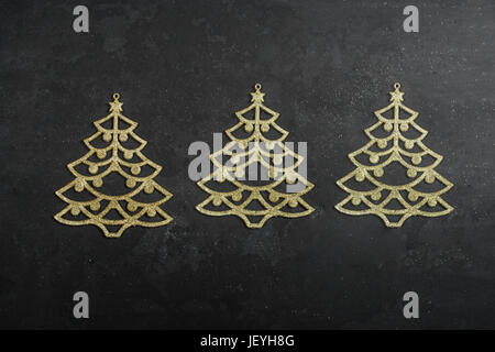 Colourful traditional Christmas decoration on black chalkboard texture of old weathered boards with copyspace Stock Photo