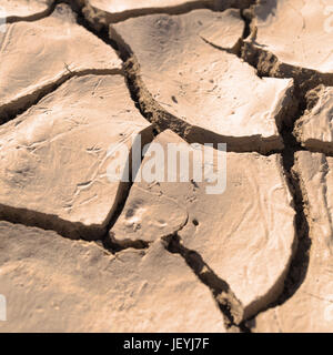 Close up of cracked, dried earth creating an abstract pattern. Stock Photo