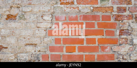 Old vintage red brick wall with white plaster texture background Stock Photo