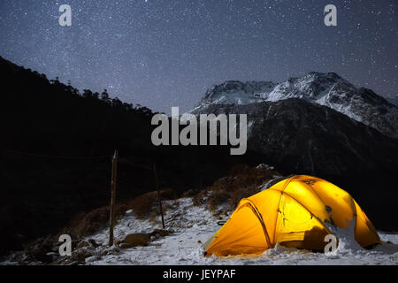 Tent high in the mountains with the stars above. Captured in Nepal, Himalayas. Stock Photo