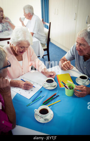 Group of seniors drawing and interacting Stock Photo