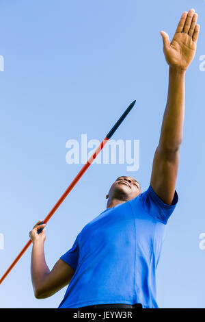 Athlete about to throw a javelin Stock Photo