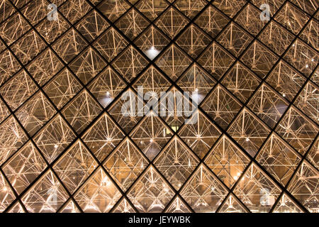 Close up view of glass pyramid at Louvre Museum (Musée du Louvre). Former historic palace housing huge art collection, from Roman sculptures to da Vin Stock Photo