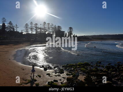 Panoramic view of Dee Why beach (Sydney NSW Australia) on a sunny day. A great place to relax as the beach is mainly frequented by locals. Stock Photo