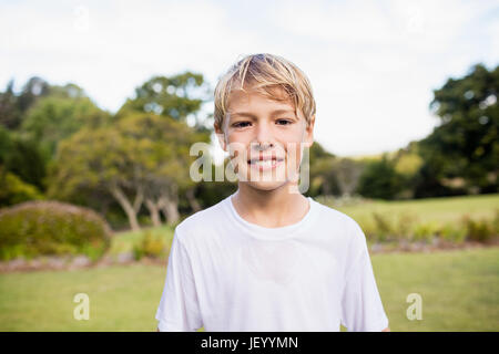 Kid posing at camera during a sunny day Stock Photo
