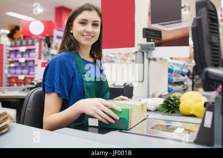 Portrait of woman cashier smiling Stock Photo