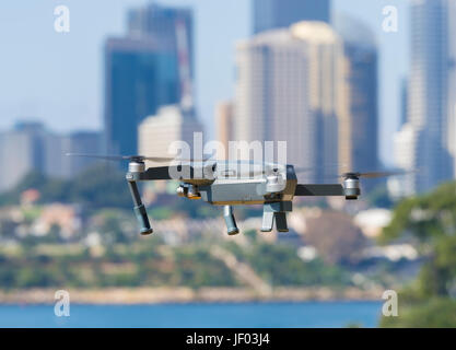 Drone flying near city centre Stock Photo