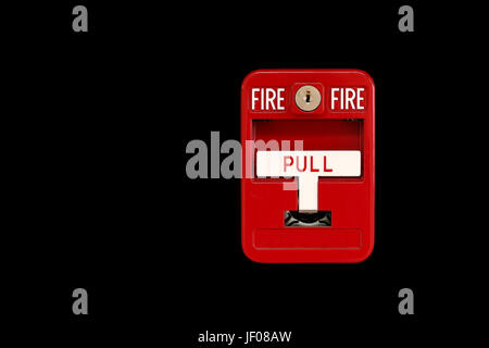 red fire alarm box on black background Stock Photo