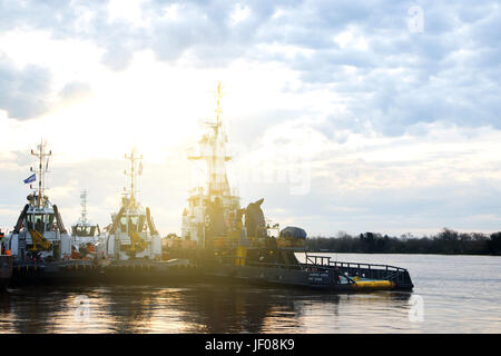 BUENOS AIRES, ARGENTINA - JUNE 27, 2017:  Tugboats are seen in the coast of Parana River Stock Photo