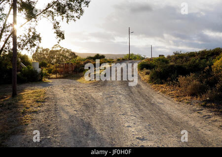 a fork in the road on a dirt road in the countryside Stock Photo