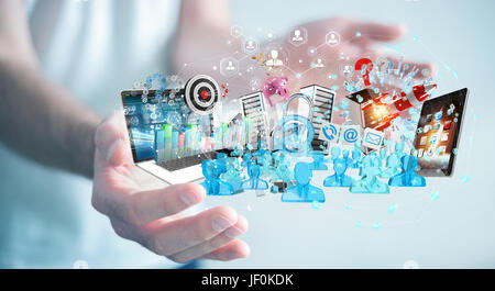 Businessman on blurred background connecting devices and business objects together 3D rendering Stock Photo