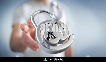 Businessman on blurred background using 3D rendered digital padlock to secure his internet datas Stock Photo