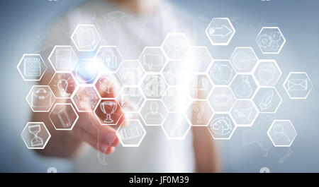 Businessman on blurred background touching multimedia hand-drawn interface Stock Photo