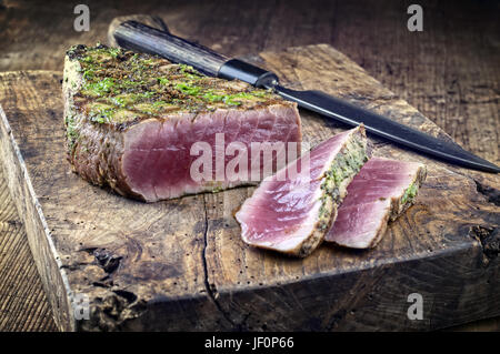 Tuna Steak on Chopping Board Stock Photo