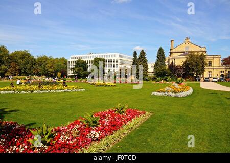 Flowerbeds in the Imperial Gardens with the town hall on the right hand side, Cheltenham, Gloucestershire, England, UK, Western Europe. Stock Photo