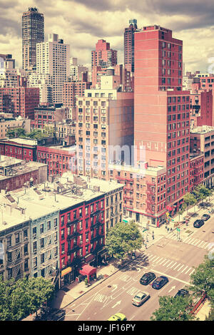 Vintage stylized picture of the famous First Avenue and city skyline on the Upper East Side, looking north from the Roosevelt Island, New York, USA. Stock Photo