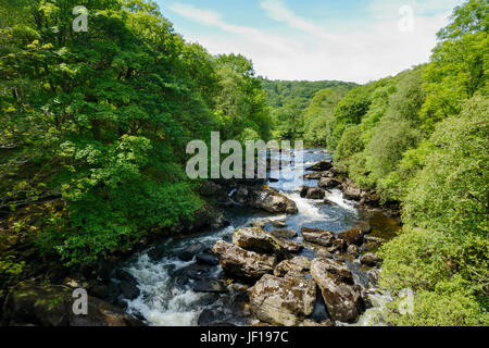 Afon Llugwy flowing through the small Welsh village of Capel Curic in Snowdonia. Stock Photo