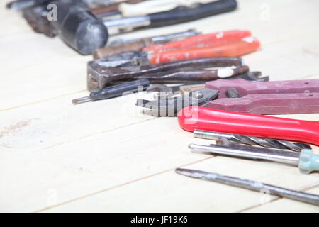tools for repairs lies on the white boards Stock Photo