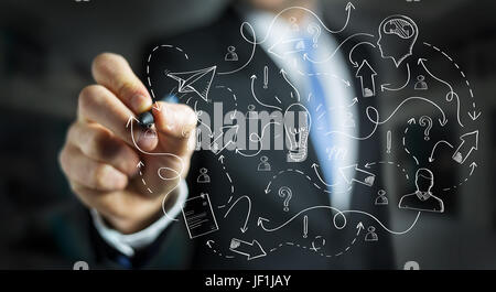 Businessman on blurred background drawing manuscript project presentation with a pen Stock Photo