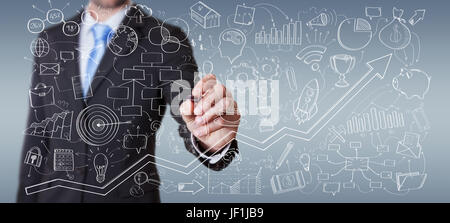 Businessman on blurred background drawing manuscript project presentation with a pen Stock Photo