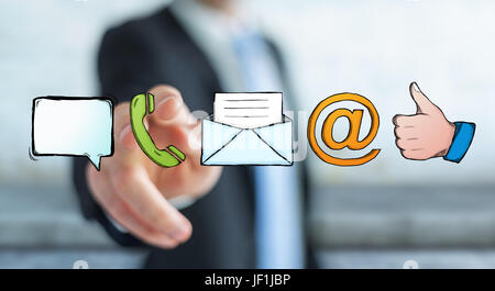 Businessman on blurred background touching manuscript contact icon with his finger Stock Photo