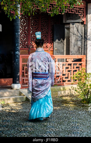 Young man dressed in traditional clothes, Ancient town of Tongli, Suzhou, Anhui province, Jiangsu Province, China Stock Photo