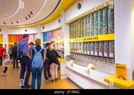 Tubes filled with chocolate covered peanuts at M&M's World in Leicester Square, London, UK Stock Photo