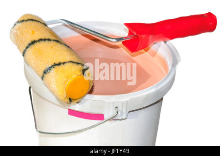 Paint roller on a bucket with paint Stock Photo