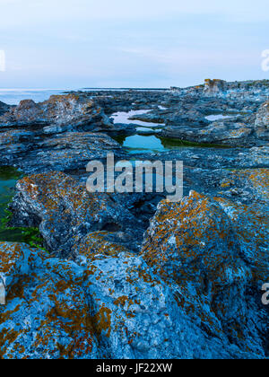 Rocky coast at dusk Stock Photo