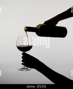 woman pouring red wine Stock Photo