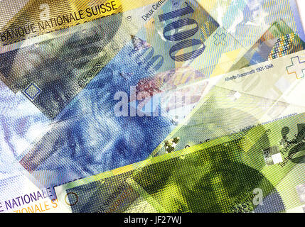 Swiss franc banknotes of different denominations. Abstract Money Background Stock Photo